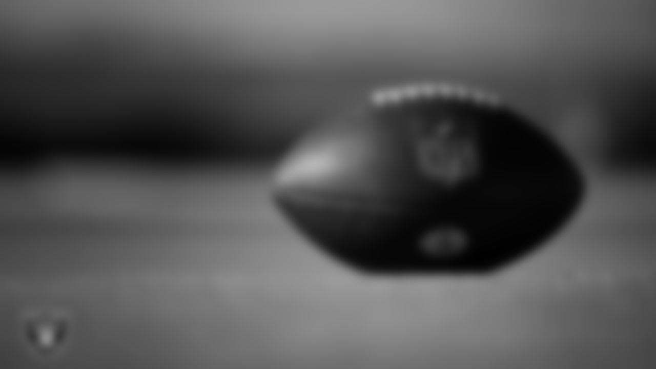 A football on the field during practice at Intermountain Health Performance Center.