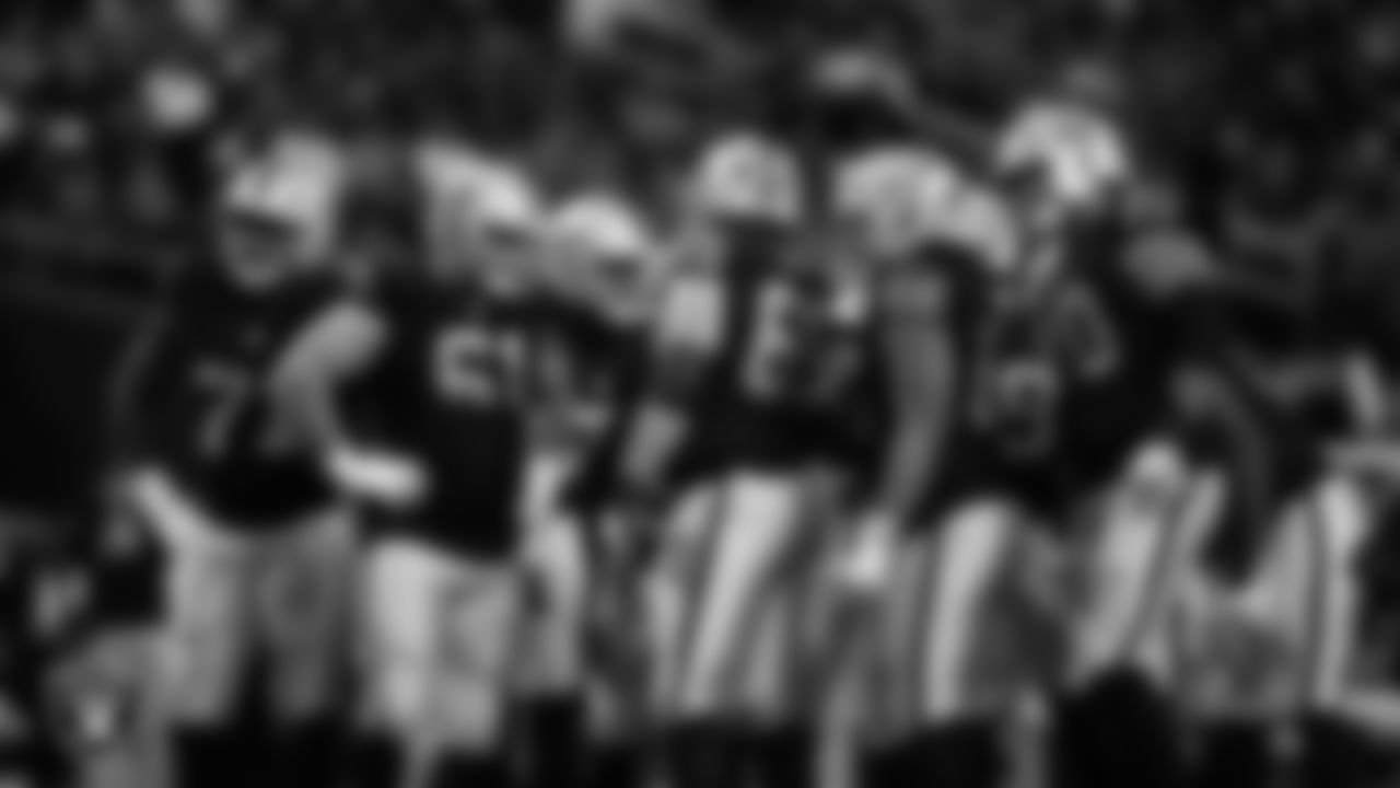 The Las Vegas Raiders offense huddles during the regular season home game against the Cleveland Browns at Allegiant Stadium.