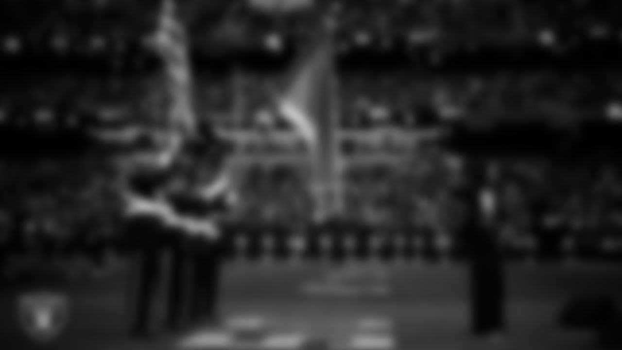 Actress and singer Renee Elise Goldsberry performs the national anthem while the Yuhaavaitam of San Manuel Nation Honor Guard presents the nation's colors before the Las Vegas Raiders' regular season home game against the Jacksonville Jaguars at Allegiant Stadium.