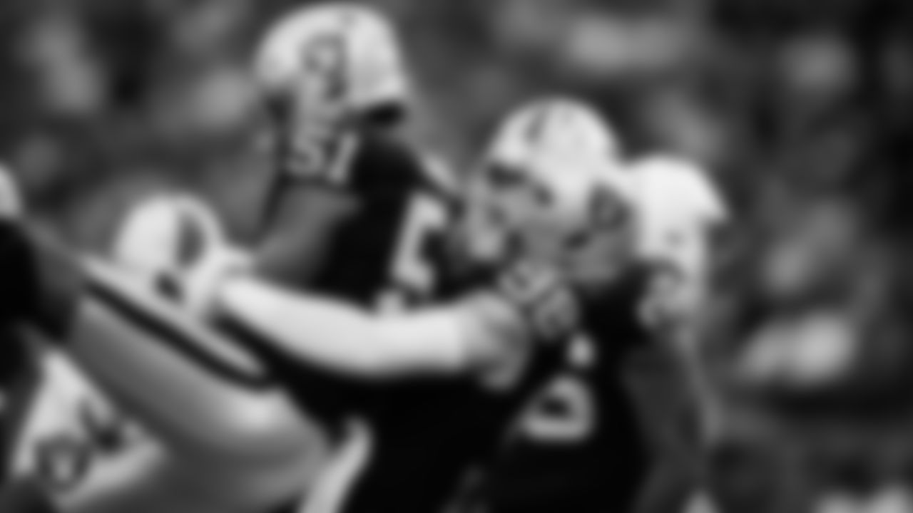 Las Vegas Raiders defensive end Malcolm Koonce (51) celebrates with defensive end Maxx Crosby (98) after sacking the quarterback during the regular season home game against the Cleveland Browns at Allegiant Stadium.