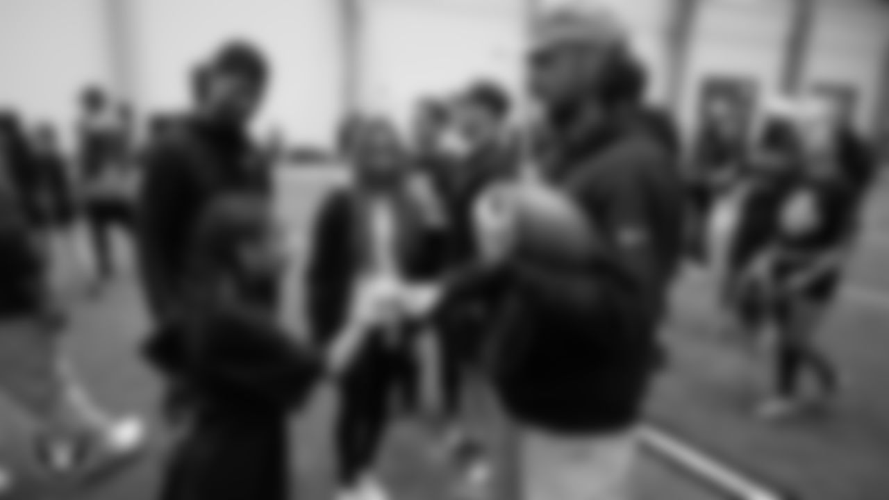 Las Vegas Raiders quarterback Gardner Minshew II (15) fist bumps an athlete during Raiders ELITE Academy at Las Vegas Raiders Headquarters.