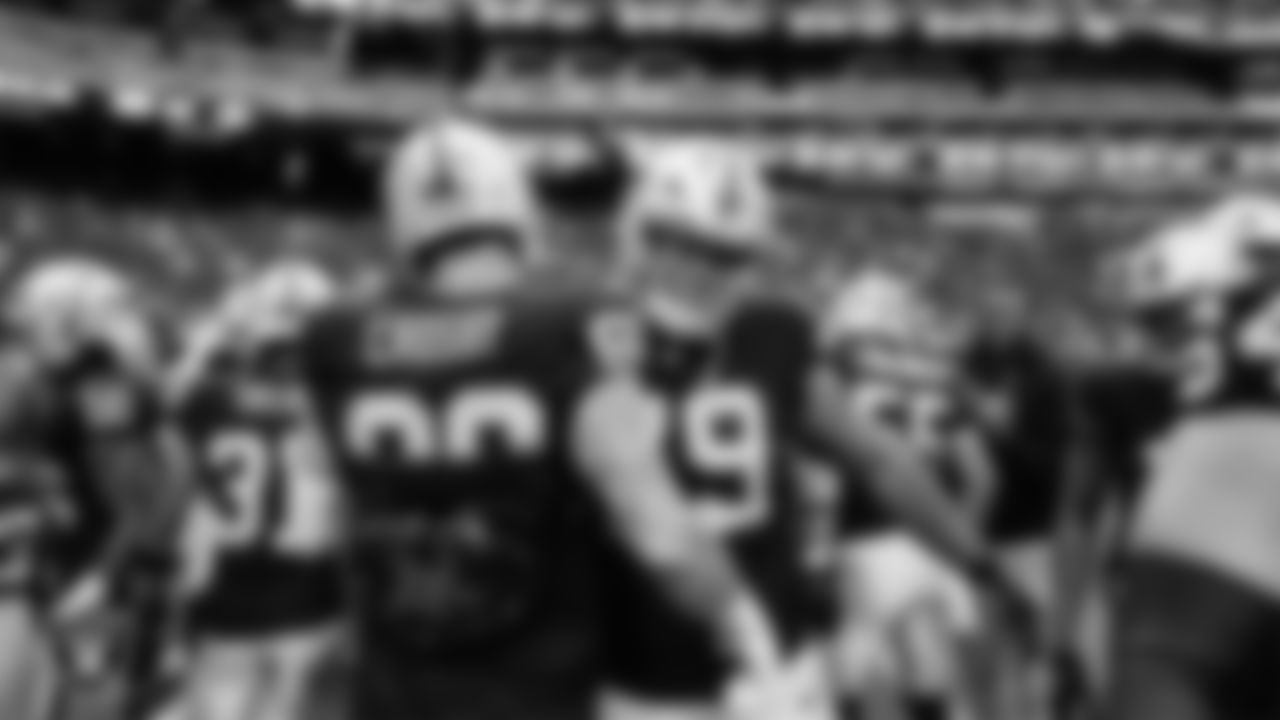Las Vegas Raiders defensive end Maxx Crosby (98) and offensvie lineman Laki Tasi (79) warming up before the preseason home game against the San Francisco 49ers at Allegiant Stadium.