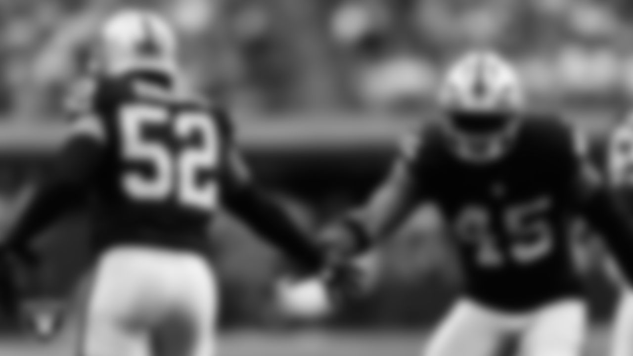 Las Vegas Raiders linebacker Elandon Roberts (52) celebrates with linebacker Devin White (45) after making a tackle during the preseason home game against the San Francisco 49ers at Allegiant Stadium.
