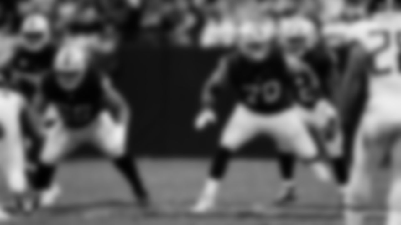 Las Vegas Raiders guard Dylan Parham (66) and offensive lineman Stone Forsythe (70) block during the regular season home game against the Tennessee Titans at Allegiant Stadium.