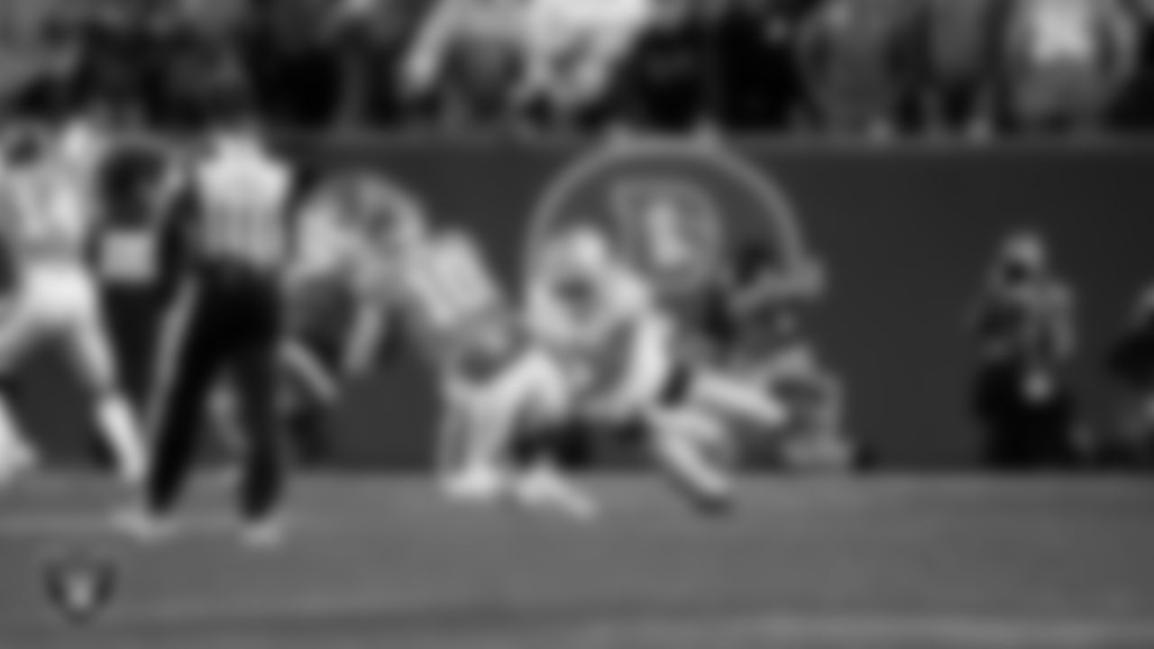 Las Vegas Raiders safety Isaiah Pola-Mao (20) makes a tackle during the regular season away game against the Denver Broncos at Empower Field at Mile High.