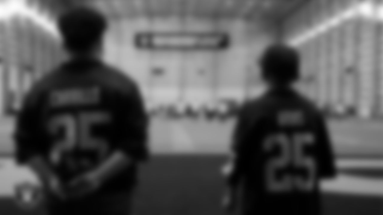 Marcos Carrillo and Christopher Arias from Make-A-Wish watch practice during a visit to Intermountain Health Performance Center.