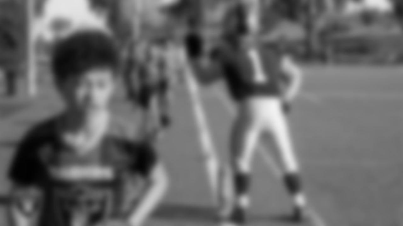 Raider Rusher encourages athletes during Silver and Black Saturday at Bill and Lillie Heinrich YMCA.