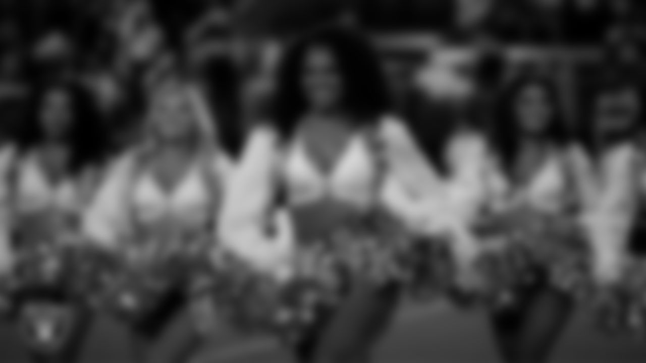 Raiderette Shayla walks onto the field for a performance before the regular season home game against the Dallas Cowboys at Allegiant Stadium.