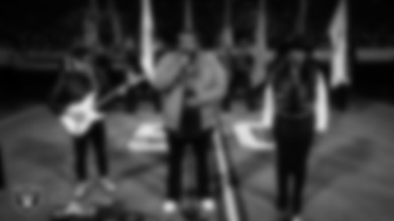 Musical duo The War and Treaty performs the national anthem while the Rancho High School Air Force JROTC Honor Guard presents the nation's colors before the Las Vegas Raiders' regular season home game against the Dallas Cowboys at Allegiant Stadium.