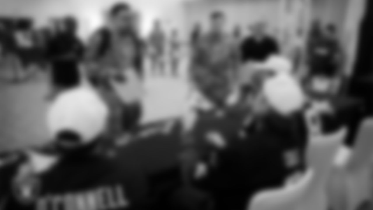 Service members get autographs from Las Vegas Raiders players at Nellis Air Force Base.