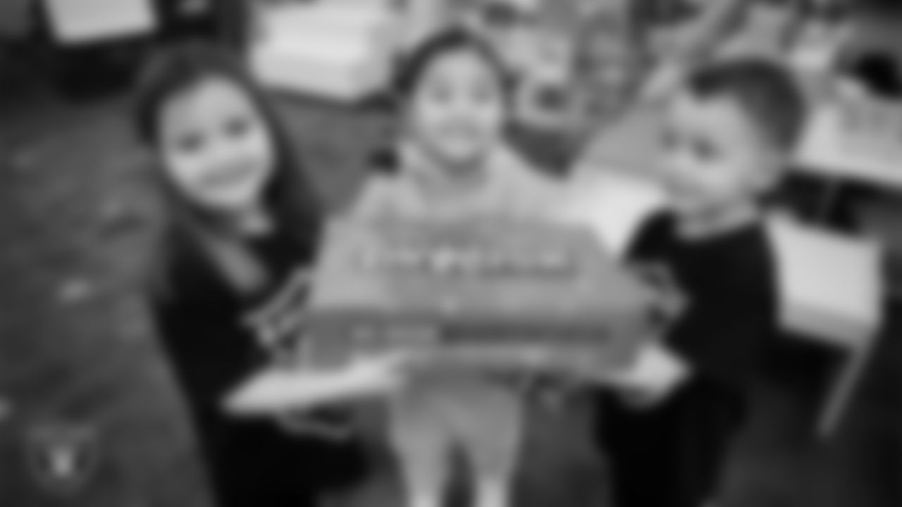 Students celebrate winning the Lil' Raiders School Challenge at Richard H. Bryan Elementary School.