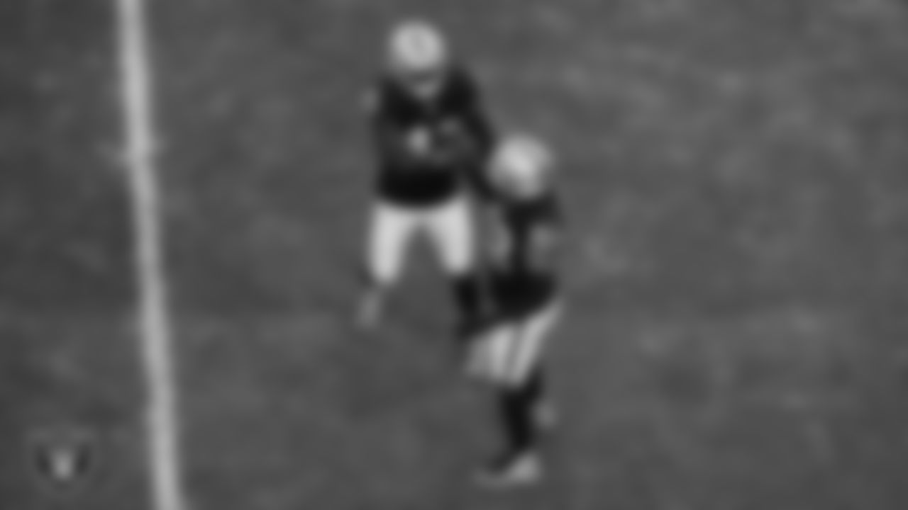 Las Vegas Raiders linebacker Devin White (45) and linebacker Elandon Roberts (52) celebrate on the field during the regular season home game against the Cleveland Browns at Allegiant Stadium.