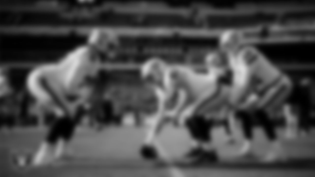 Las Vegas Raiders guard Caleb Rogers (76), center Will Putnam (67) and quarterback Aidan O'Connell (12) warming up before the regular season away game against the Philadelphia Eagles at Lincoln Financial Field.