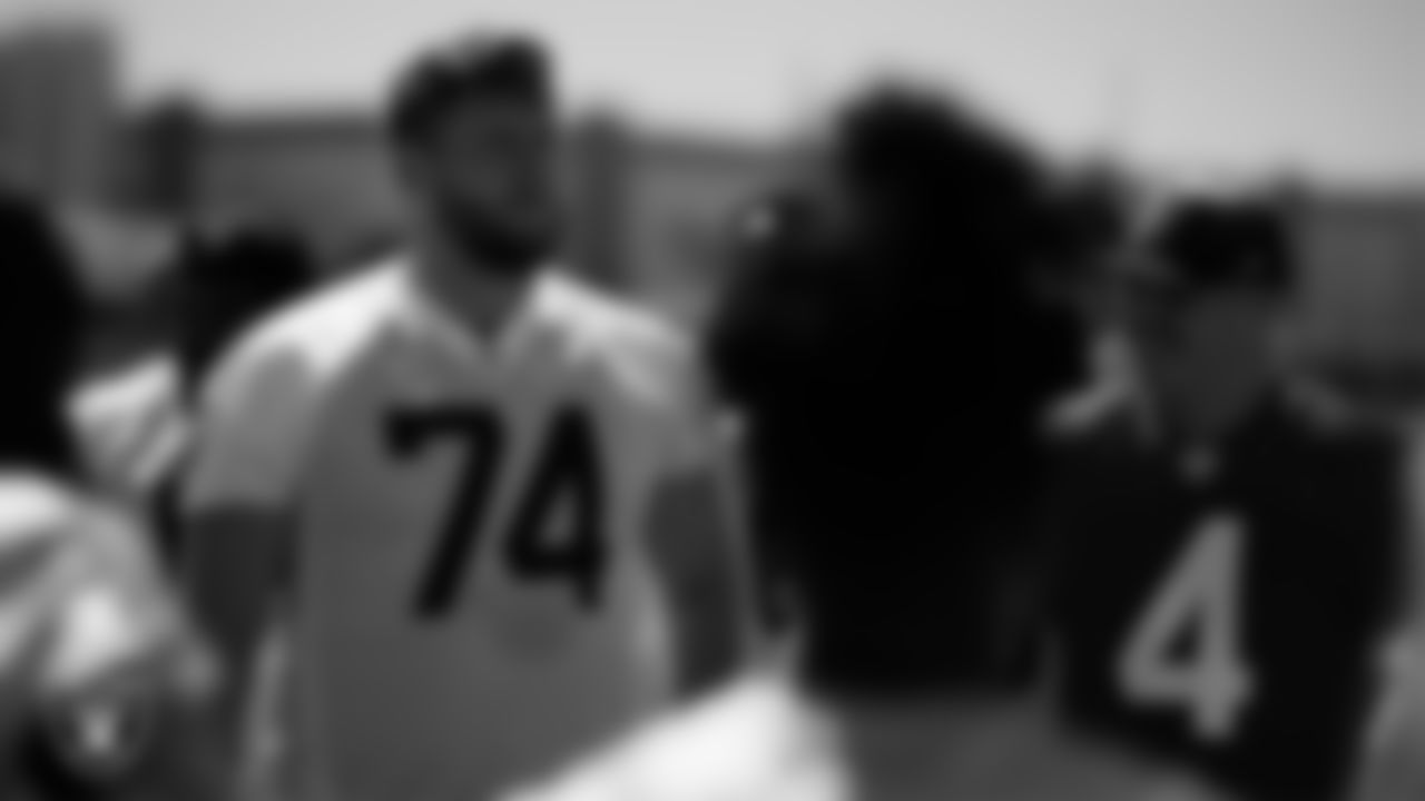 Las Vegas Raiders tackle Kolton Miller (74) and quarterback Aidan O'Connell (4) at a workout during phase two of the offseason program at Intermountain Health Performance Center.