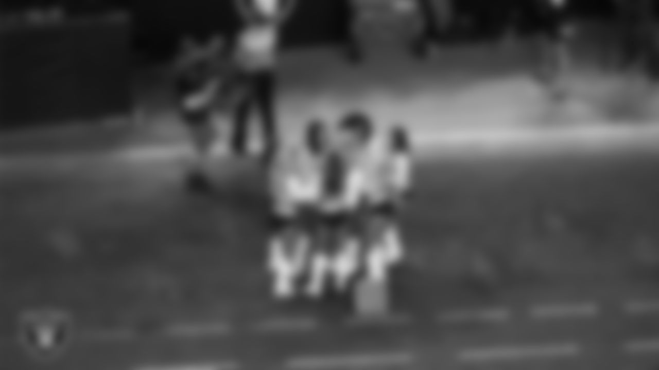 Line 4 of the Raiderettes celebrates Raiderette Jessica being honored as Raiderette of the Game during the regular season home game against the Dallas Cowboys at Allegiant Stadium.