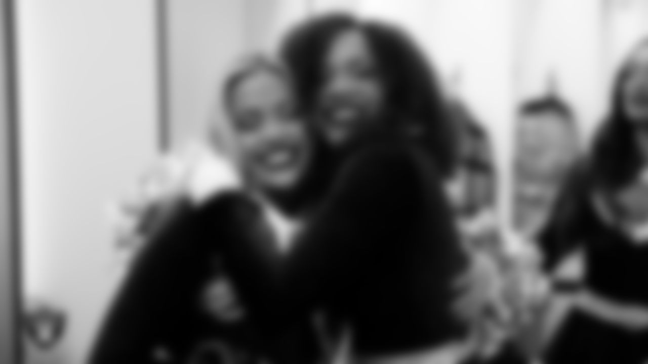 Raiderette Devyn celebrates with Raiderette Makenna after being named Raiderette of the Game in the locker room before the regular season home game against the New York Giants at Allegiant Stadium.