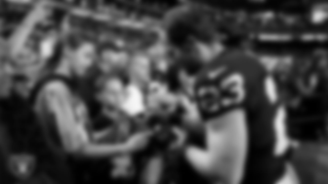 Las Vegas Raiders running back Dylan Laube (23) signs autographs for fans before the regular season home game against the Dallas Cowboys at Allegiant Stadium.