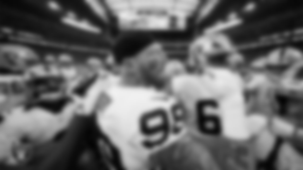 The Las Vegas Raiders huddle before the regular season away game against the Houston Texans at NRG Stadium.