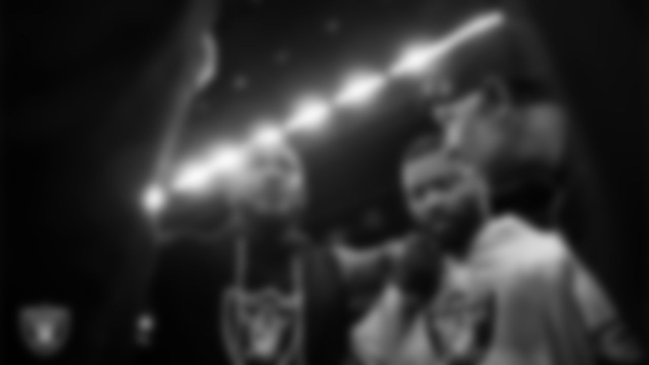 The Las Vegas Raiders linebackers huddle before the regular season away game against the Indianapolis Colts at Lucas Oil Stadium.