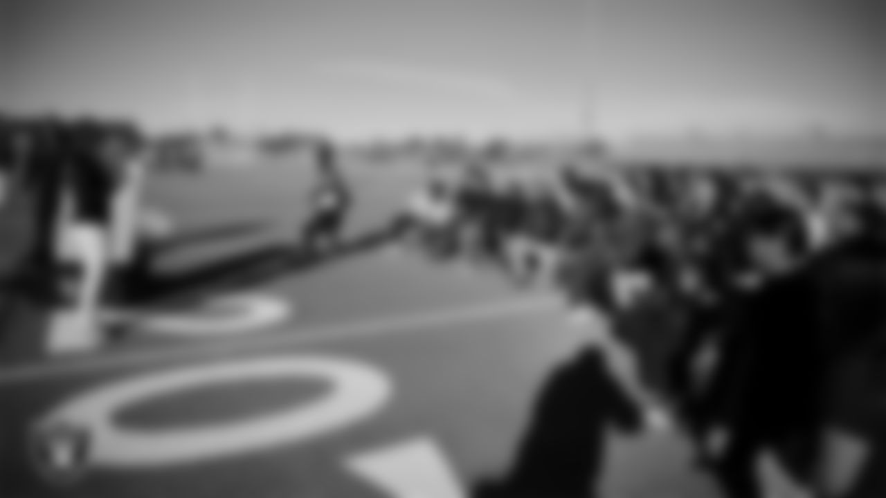 Las Vegas Raiders manager of football development Marli Bartlett talks to the Del Sol Academy of the Performing Arts flag football team during practice at Del Sol Academy of the Performing Arts.