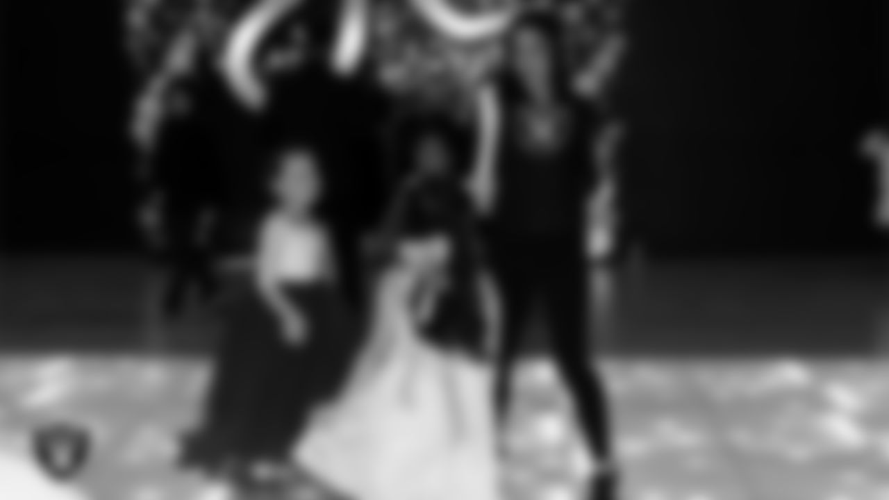 Raiderette Reagan dances with attendees during the Valentine's Day Dance at The Studio.