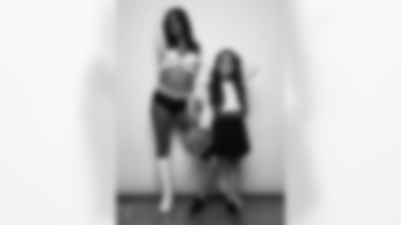 Raiderette Reagan poses for a photo with a Junior Raiderette during 2025 Media Day at The Studio.