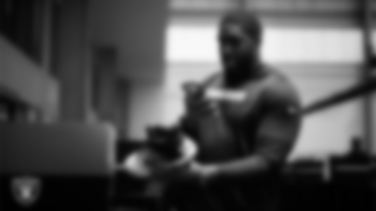 Las Vegas Raiders tackle DJ Glaze (71) unboxes his custom cleats for the NFL's My Cause My Cleats initiative at Intermountain Health Performance Center.