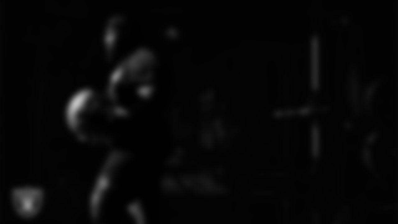 Las Vegas Raiders guard Layden Robinson (64) walks out to the field for practice at Intermountain Health Performance Center.