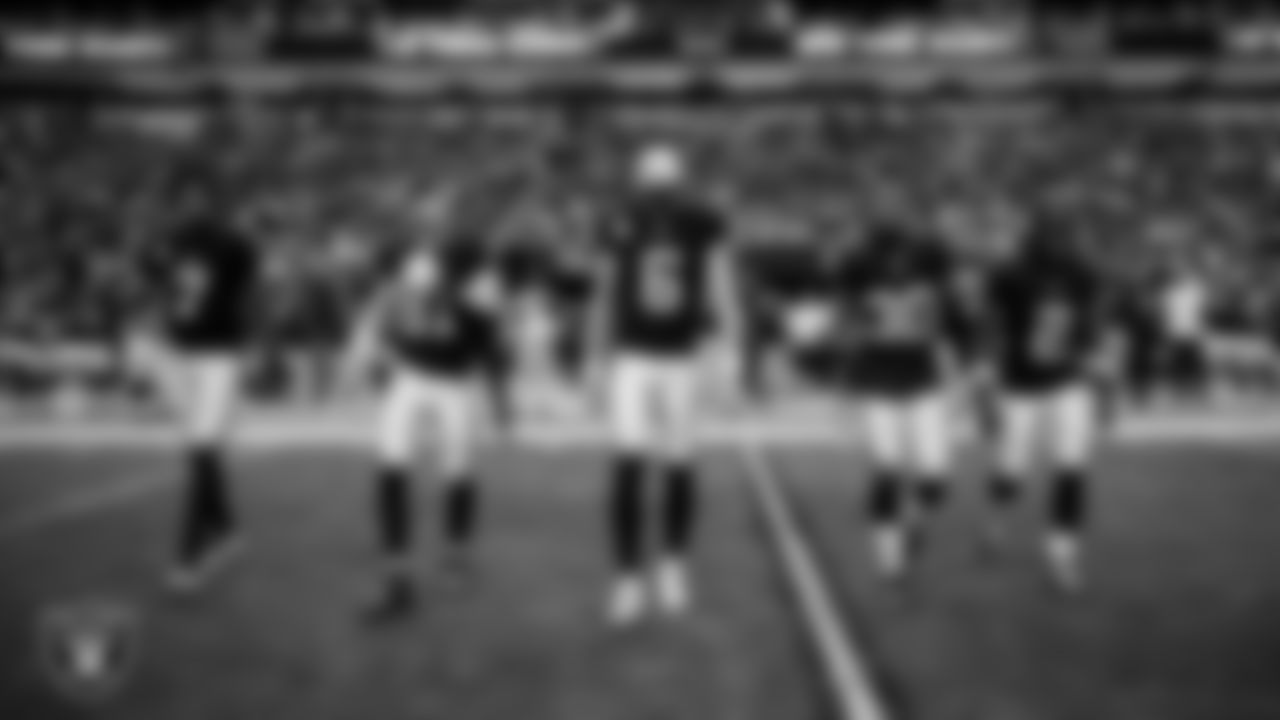The Las Vegas Raiders walk out to the center of the field for the coin toss before the regular season home game against the the New York Giants at Allegiant Stadium.
