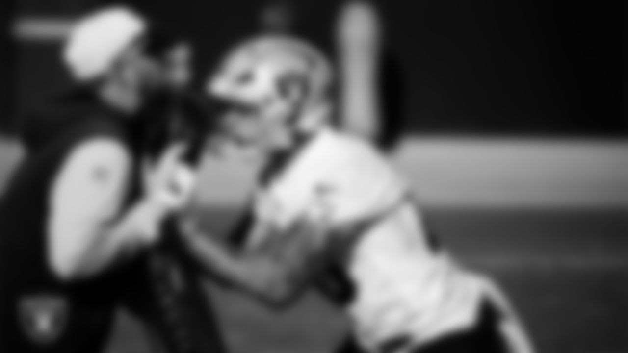 Las Vegas Raiders tight ends coach Luke Steckel and tight end Carter Runyon (46) during practice at Intermountain Health Performance Center.