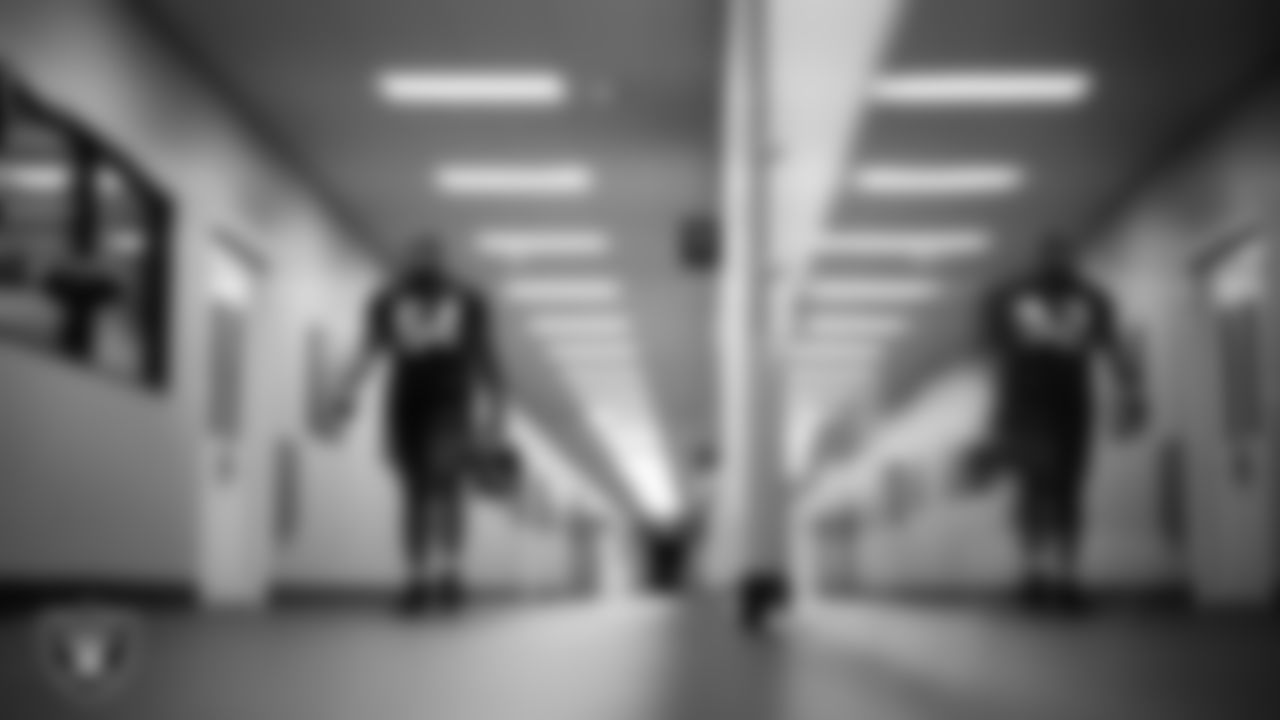 Las Vegas Raiders guard Layden Robinson (64) walks out to the field for practice at Intermountain Health Performance Center.