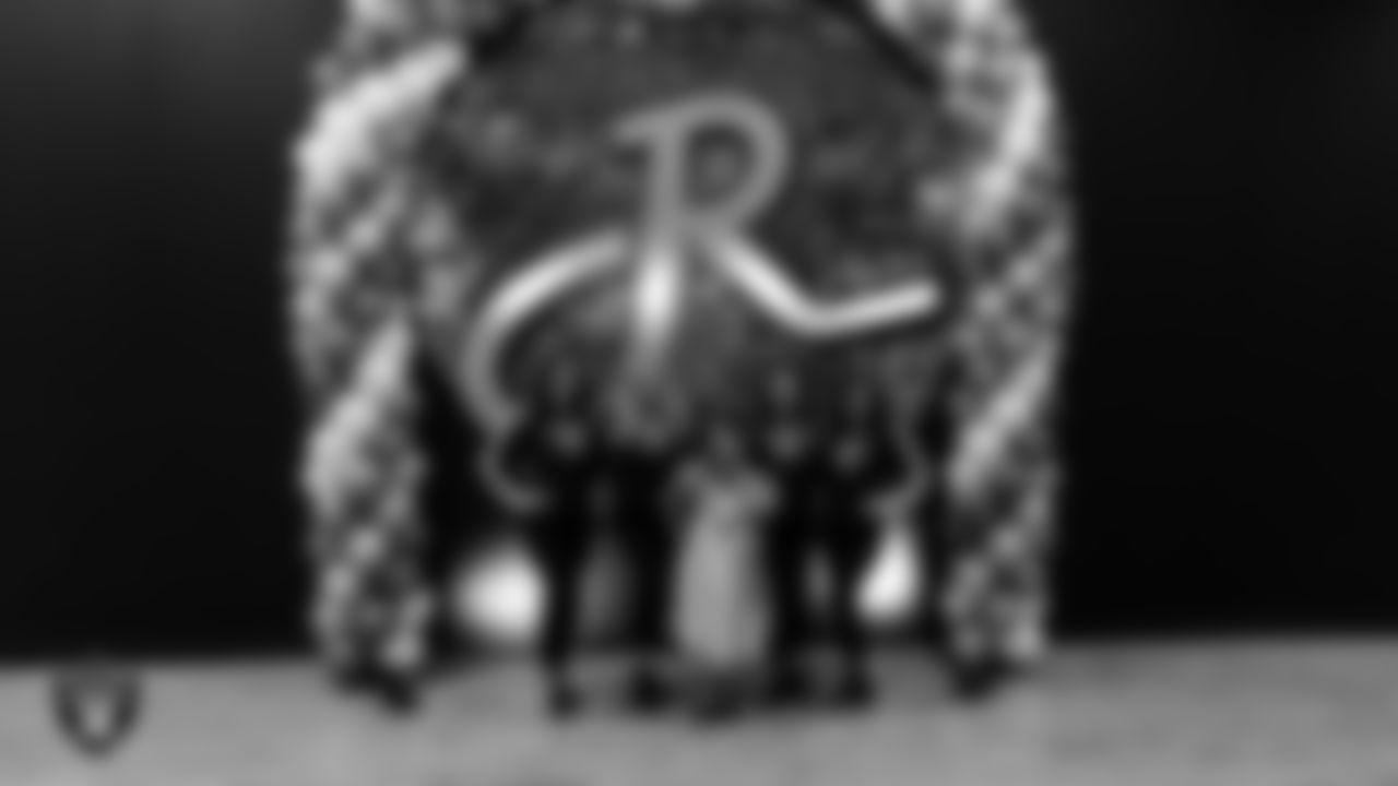 Raiderettes Reagan, Delaney, Lexie and Ashtin pose for a photo with an attendee during the Valentine's Day Dance at The Studio.