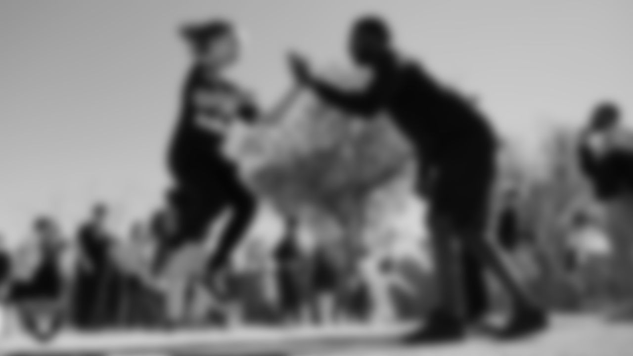 A student goes through a drill during a Junior Raiders Training Camp at Neil C Twitchell Elementary.