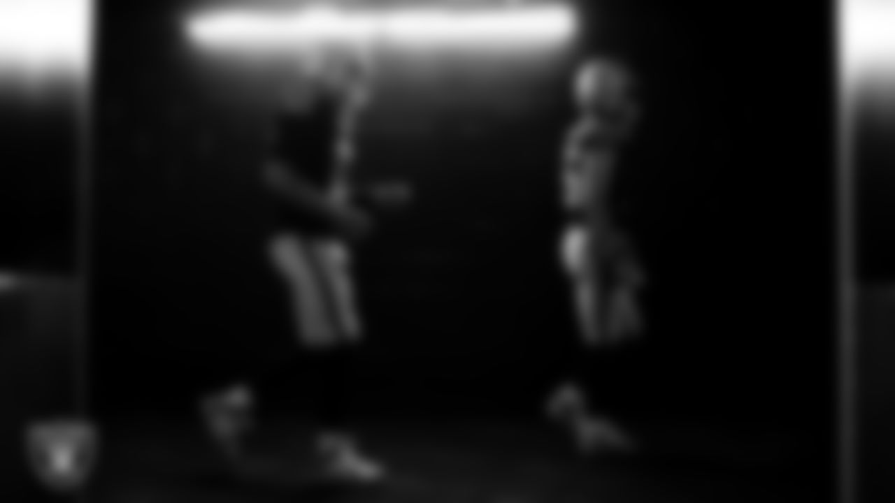 Las Vegas Raiders quarterback Aidan O'Connell (12) and quarterback Kenny Pickett (15) walk down the tunnel before the regular season home game against the Cleveland Browns at Allegiant Stadium.