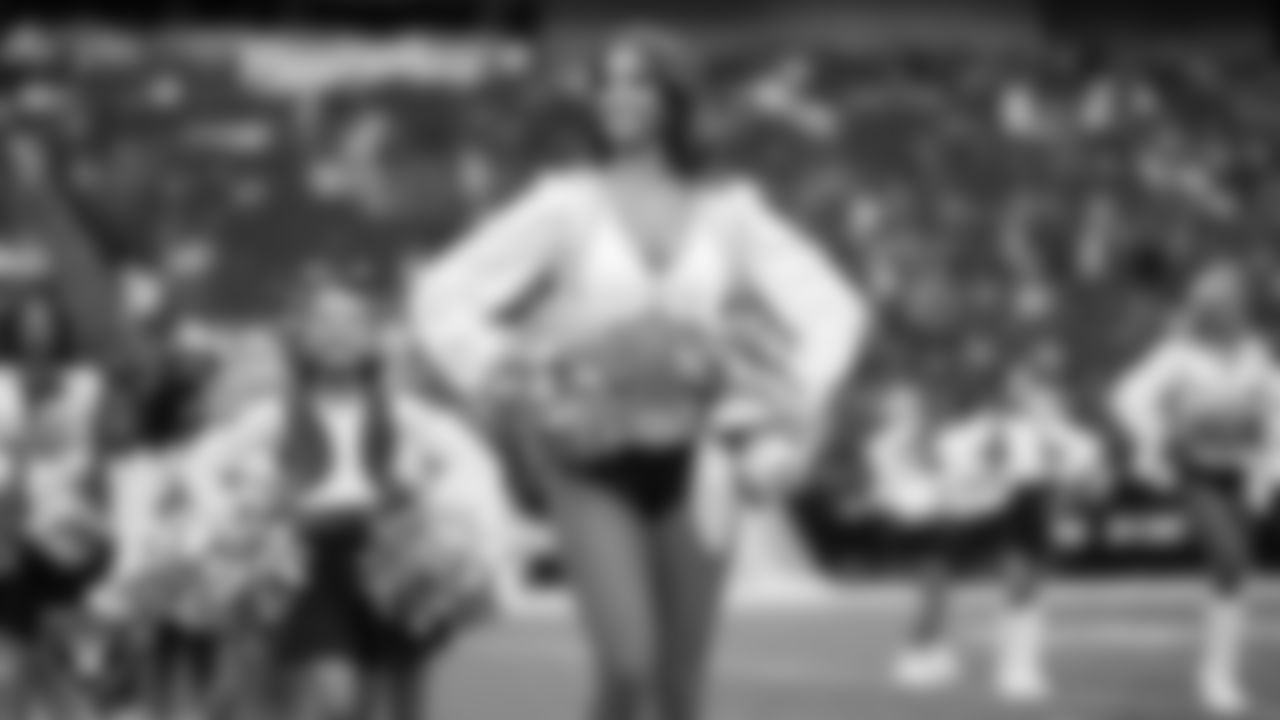 Raiderette Raegen and Junior Raiderettes perform on the field before the preseason home game against the San Francisco 49ers at Allegiant Stadium.