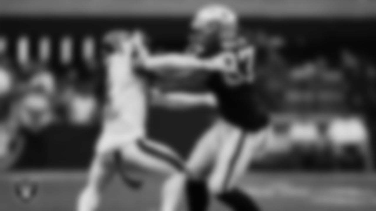 Las Vegas Raiders tight end Foster Moreau (87) stiff arms the defender during the regular season home game against the Houston Texans at Allegiant Stadium, Sunday, October 23, 2022, in Las Vegas, Nev.