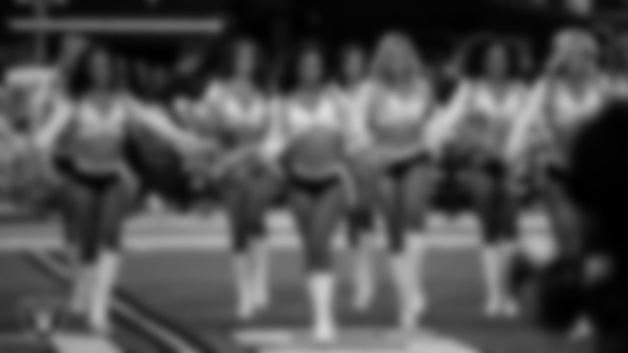 Raiderette Cierra walks onto the field for a performance before the regular season home game against the Dallas Cowboys at Allegiant Stadium.