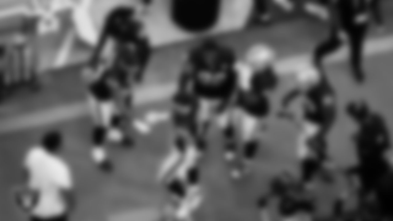 Las Vegas Raiders defensive end Maxx Crosby (98) celebrates with teammates after making an interception during the regular season home game against the Chicago Bears at Allegiant Stadium.