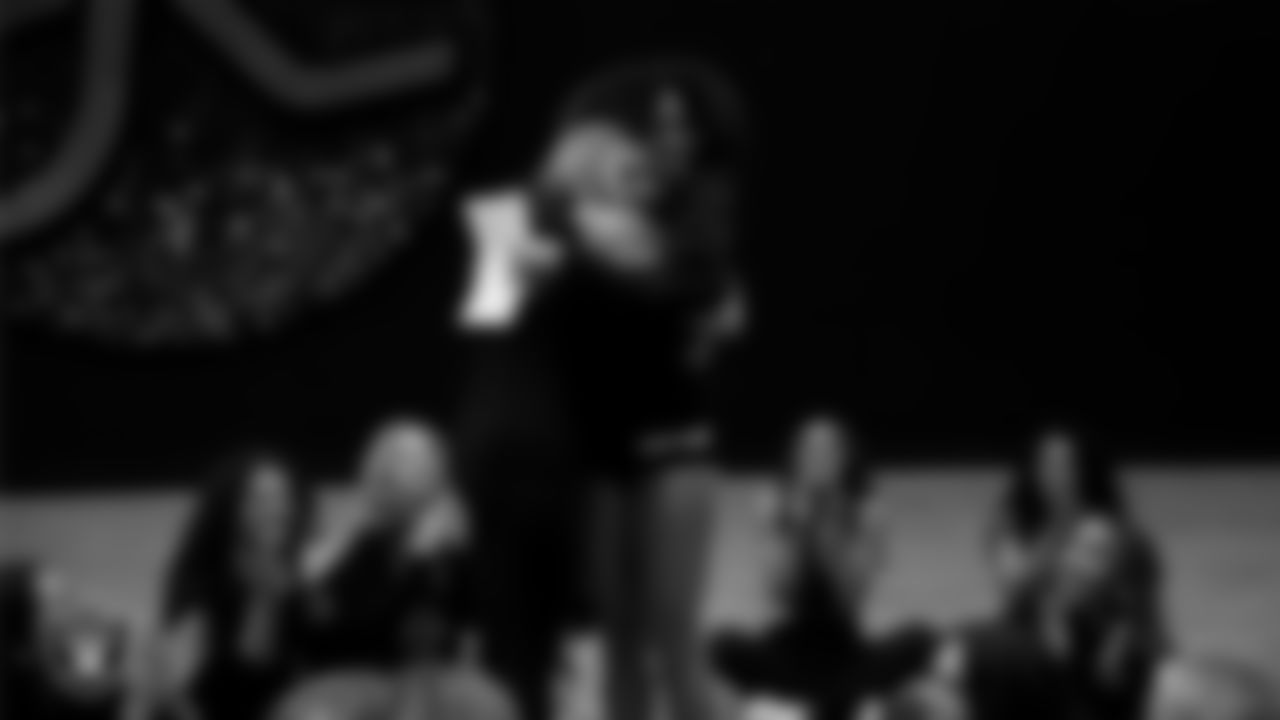 Raiderettes Director Tiphanie McNiff presents a Silver Ticket to a dancer after a recruitment clinic at The Studio.