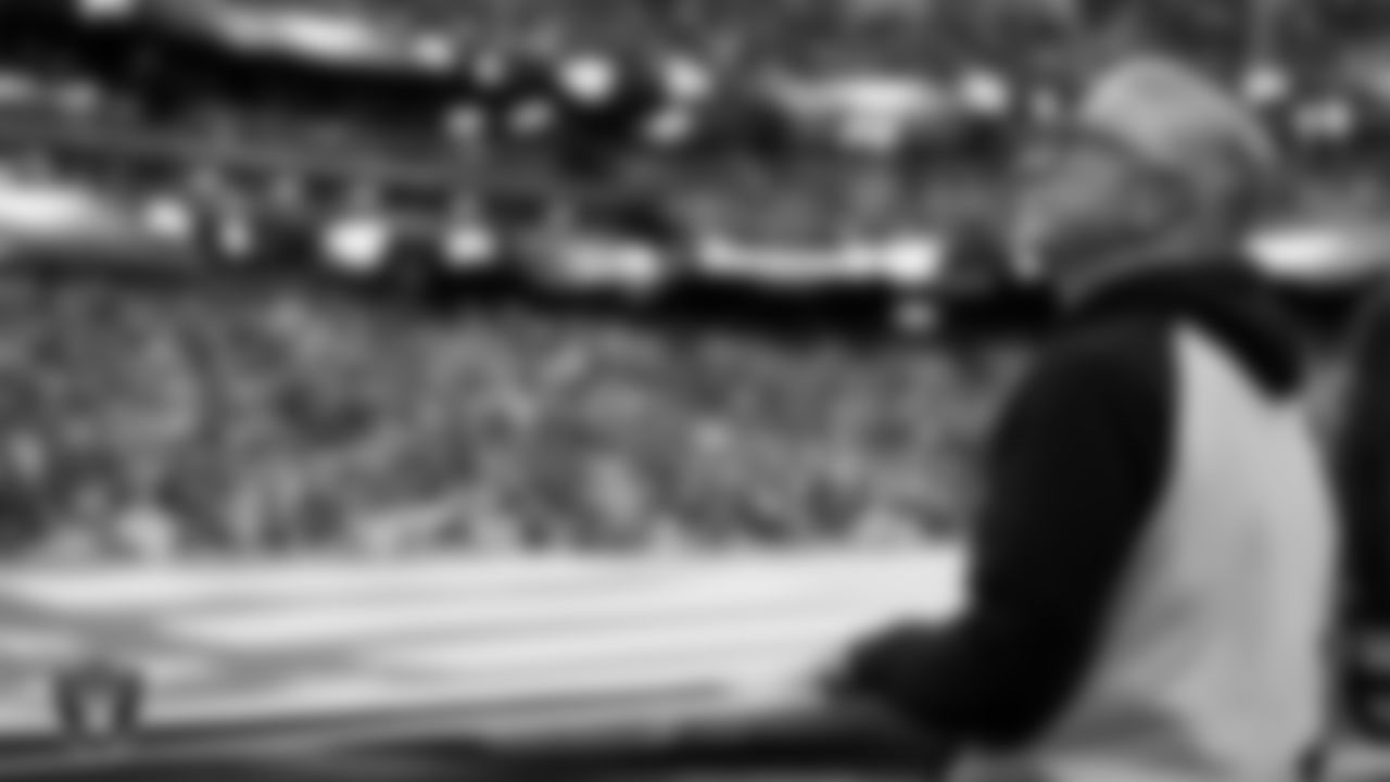 The American flag is displayed by Personal Seat License (PSL) holders on the field during the national anthem before the Las Vegas Raiders' regular season home game against the New York Giants at Allegiant Stadium.