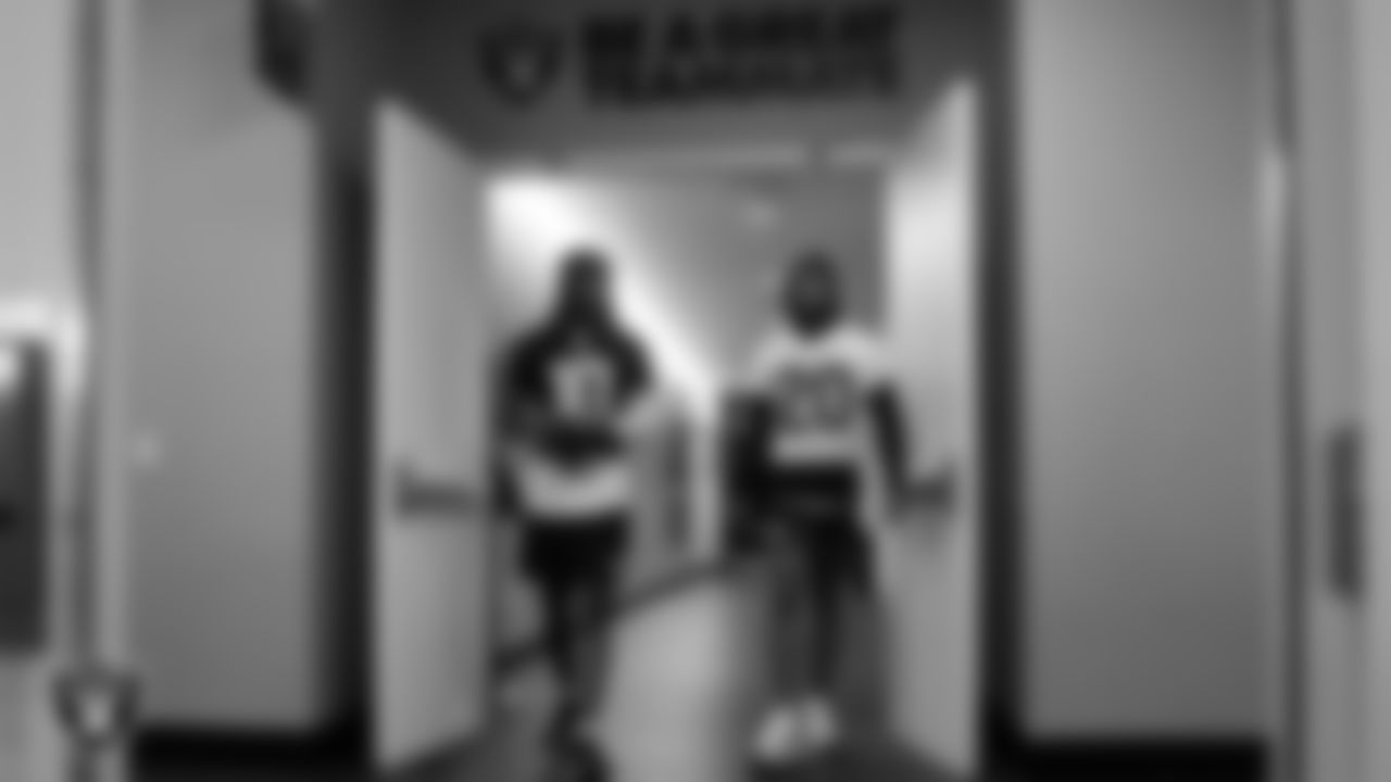 Las Vegas Raiders wide receiver Dont'e Thornton Jr. (10) and safety Isaiah Pola-Mao (20) walk out to the field for practice at Intermountain Health Performance Center.
