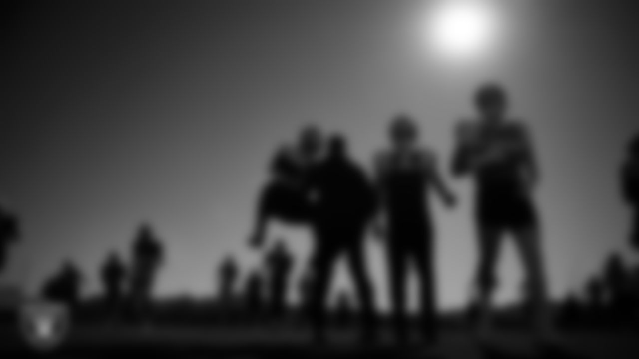 Las Vegas Raiders linebacker Devin White (45), head strength and conditioning coach A.J. Neibel, linebacker Tommy Eichenberg (44) and defensive end Maxx Crosby (98) during practice at Intermountain Health Performance Center.