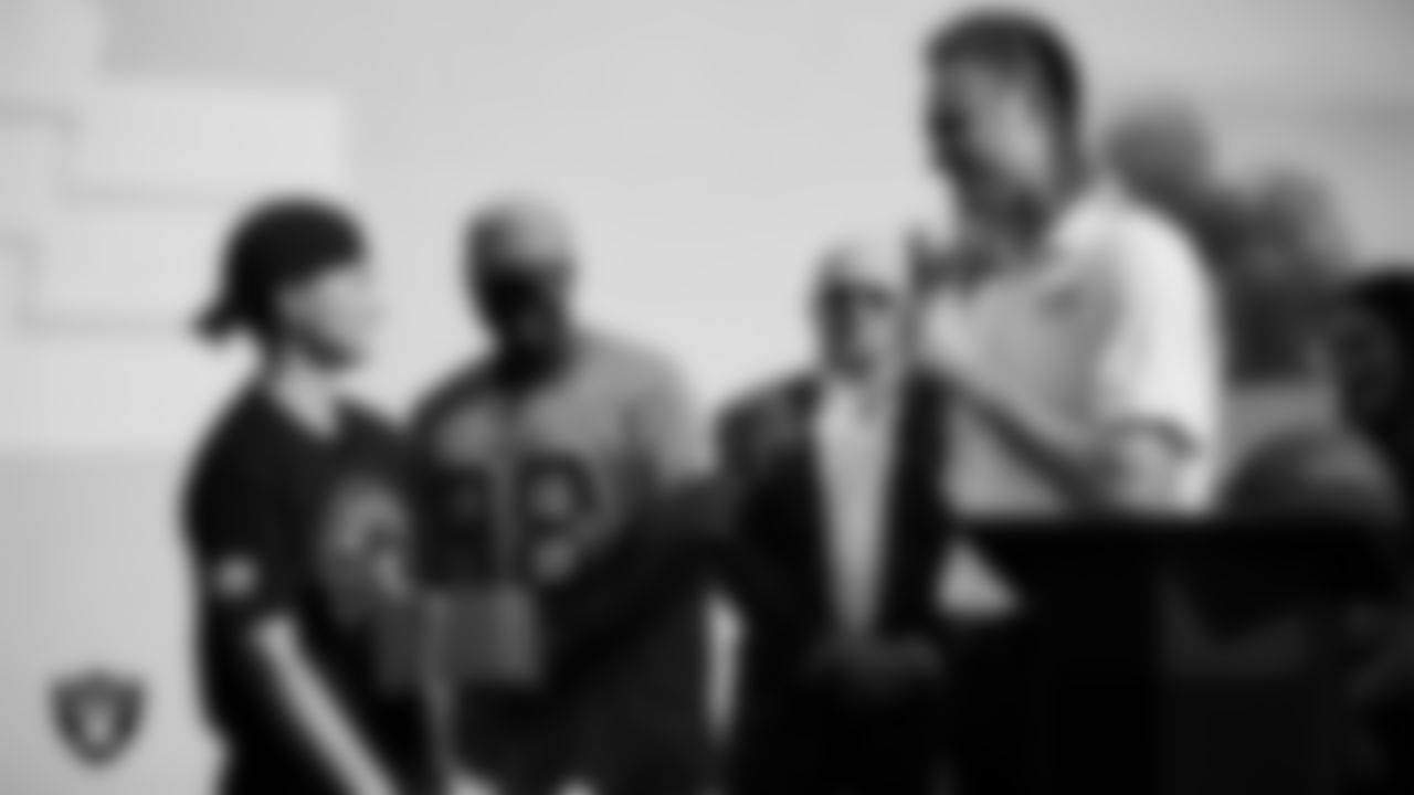 Fox 5 anchor and reporter Mike Allen speaks to a U.S VETS veteran during the Veterans Tailgate in Downtown Las Vegas.