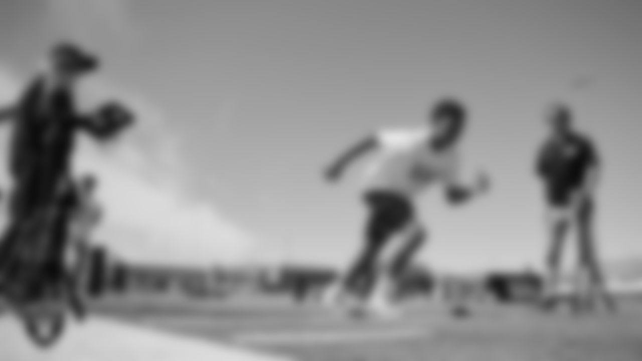 An athlete goes through a drill during a youth football combine at Durango High School.