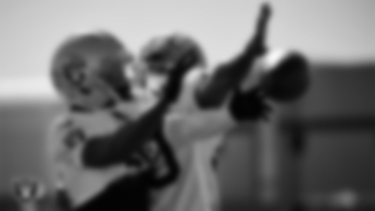 Las Vegas Raiders cornerback Darnay Holmes (30) and safety JT Woods (40) during practice at Intermountain Health Performance Center.