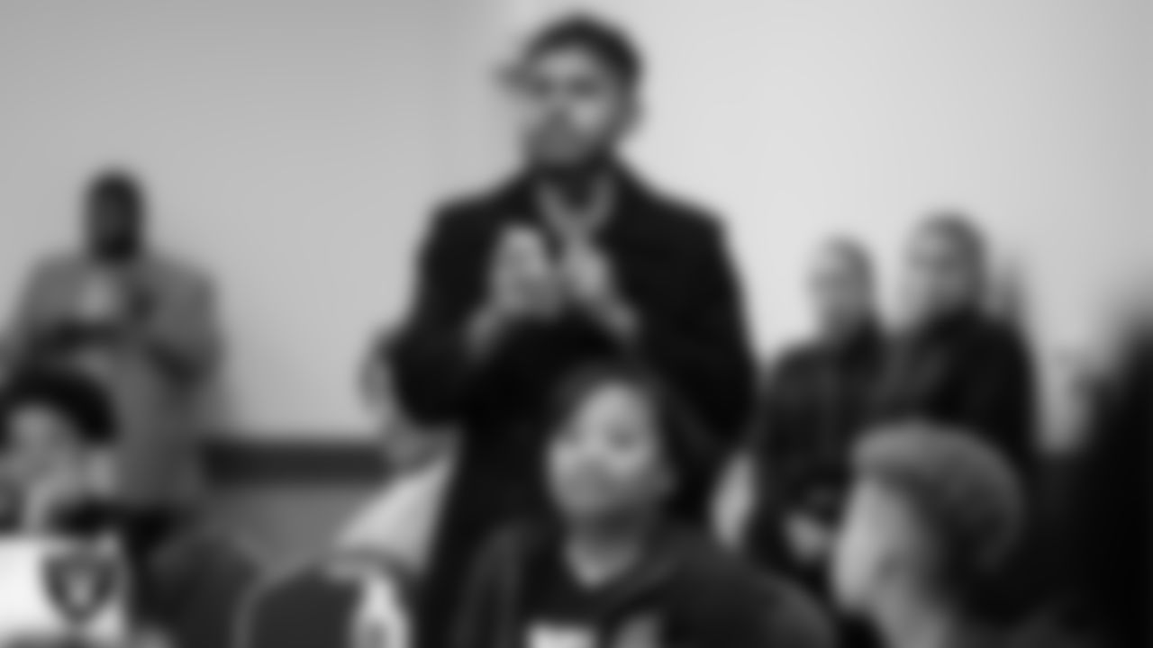 A youth community member asks a question to the panel during "The Talk" at the Culinary Academy of Las Vegas.