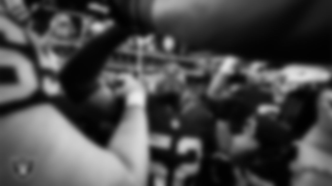 Las Vegas Raiders linebacker Elandon Roberts (52) in a huddle before the regular season home game against the Kansas City Chiefs at Allegiant Stadium.