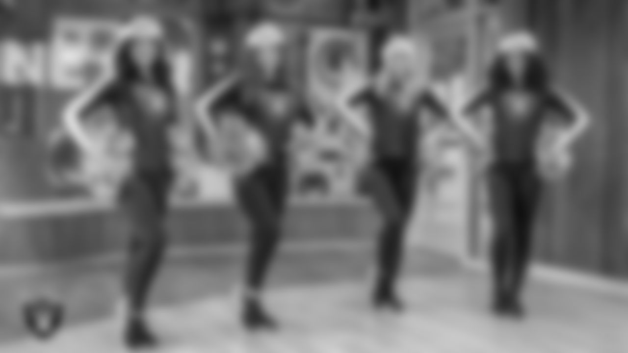 Raiderettes Sloane, Lexie, Kennedy and Shayla pose for a photo during a toy drive at Intermountain Health Primary Children's Hospital.