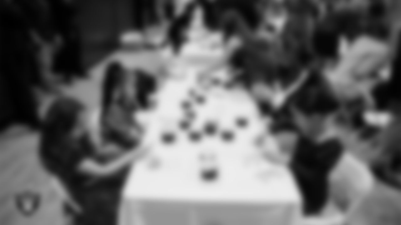 Raiderette Shelby and Junior Raiderettes enjoy activities during the Junior Raiderettes Banquet at The Studio.