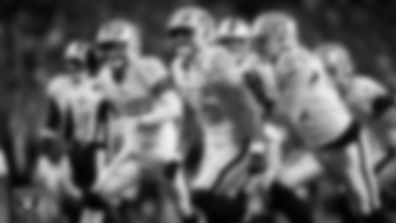 Las Vegas Raiders linebacker Cody Lindenberg (55) celebrates with teammates after making a tackle during the regular season away game against the Denver Broncos at Empower Field at Mile High.